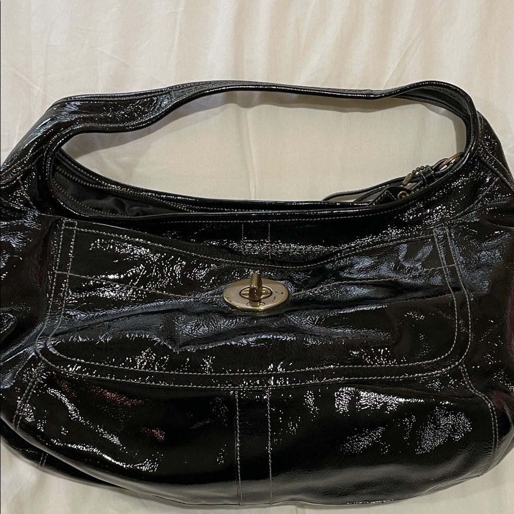 Coach women’s Shiny paten leather Black Hobo Bag